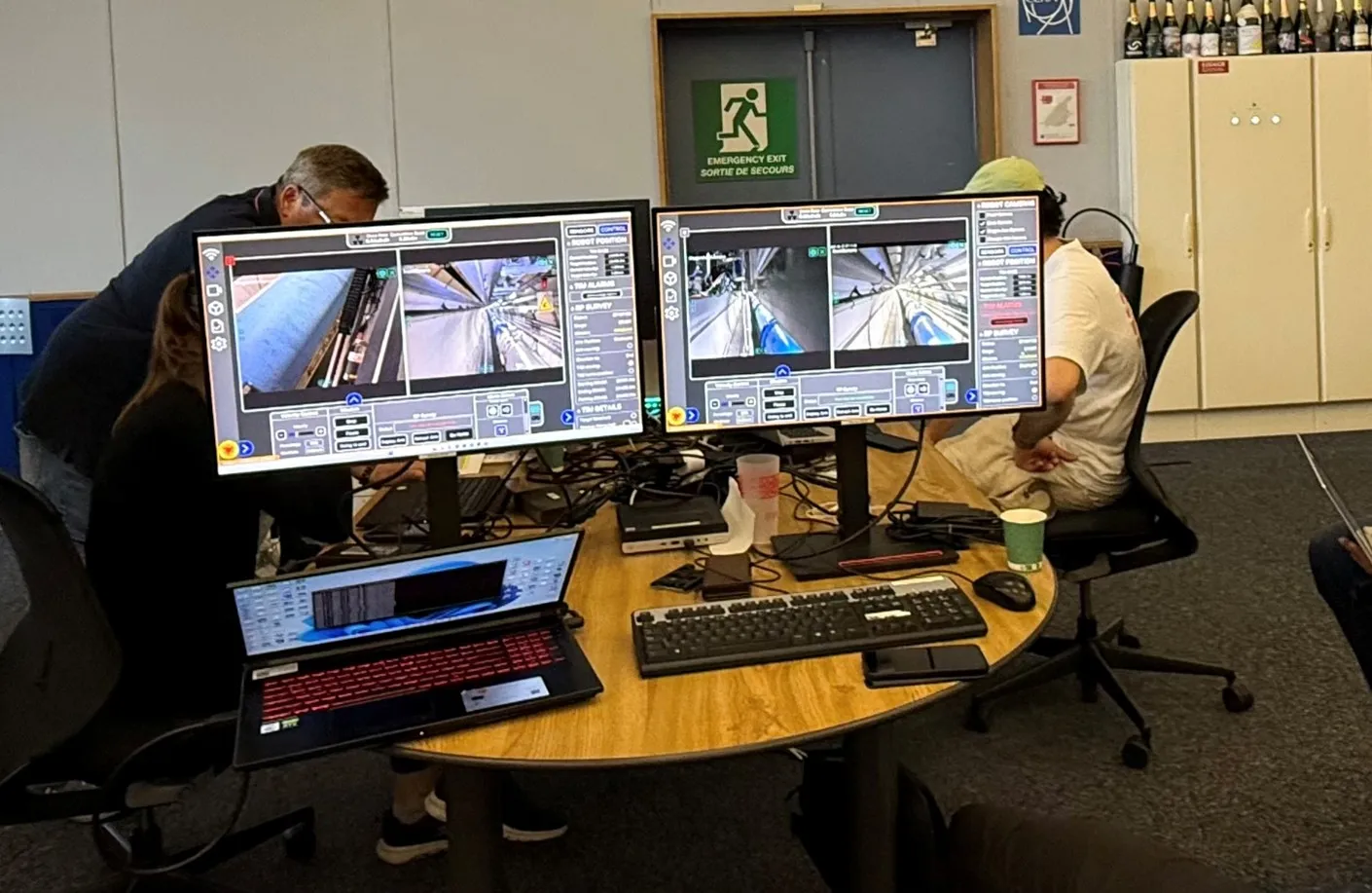 TIM Operator workstations in the CCC with the human-robot-interface for TIM81 and TIM12 shown on the screens